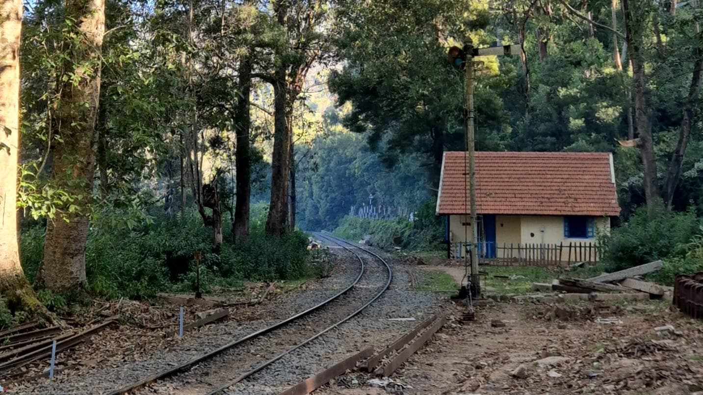 Steam locomotive toy train on a bridge in Nilgiris